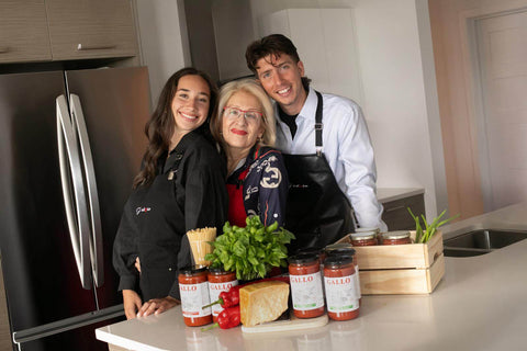 Family portrait in a modern kitchen with cooking ingredients and aprons, embodying culinary passion and tradition.