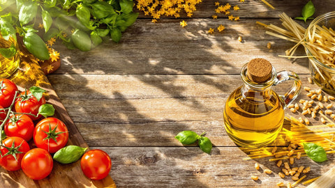 Artisanal Italian ingredients on a rustic wooden table.